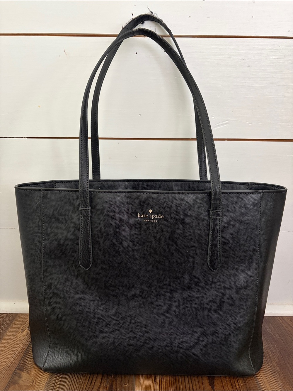 kate spade black leather tote with gold logo